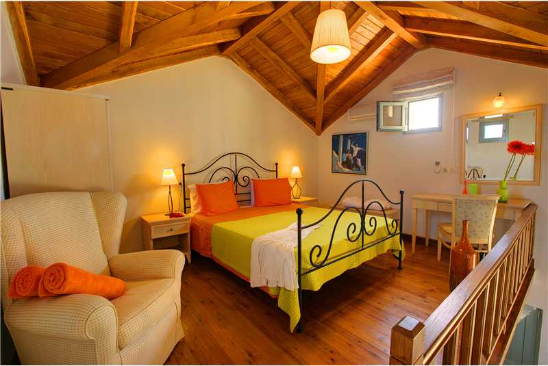 Villa Elea wooden galleried master double bedroom