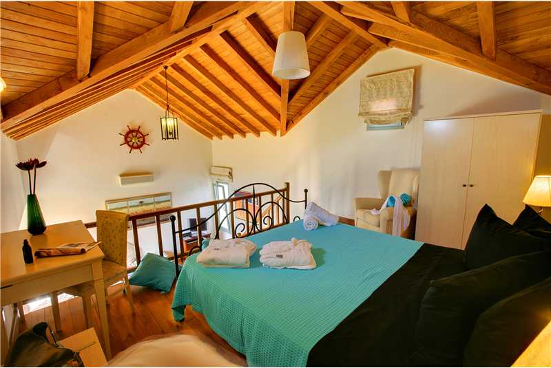 Villa Glaroni master double with high wooden vaulted ceilings