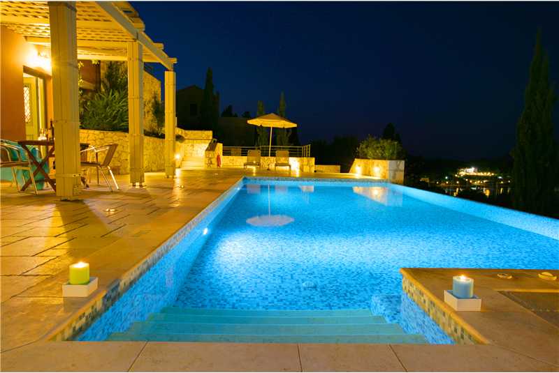 Villa Jasemi pool illuminated at night